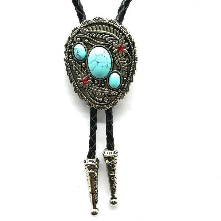 Corbata de bolo con incrustaciones de tres piedras y flores talladas