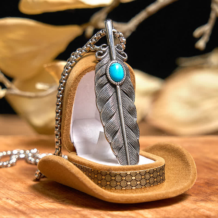 Conjunto de collar y anillo con pluma turquesa y hebilla de cinturón con cuchillo oculto de alas angulares