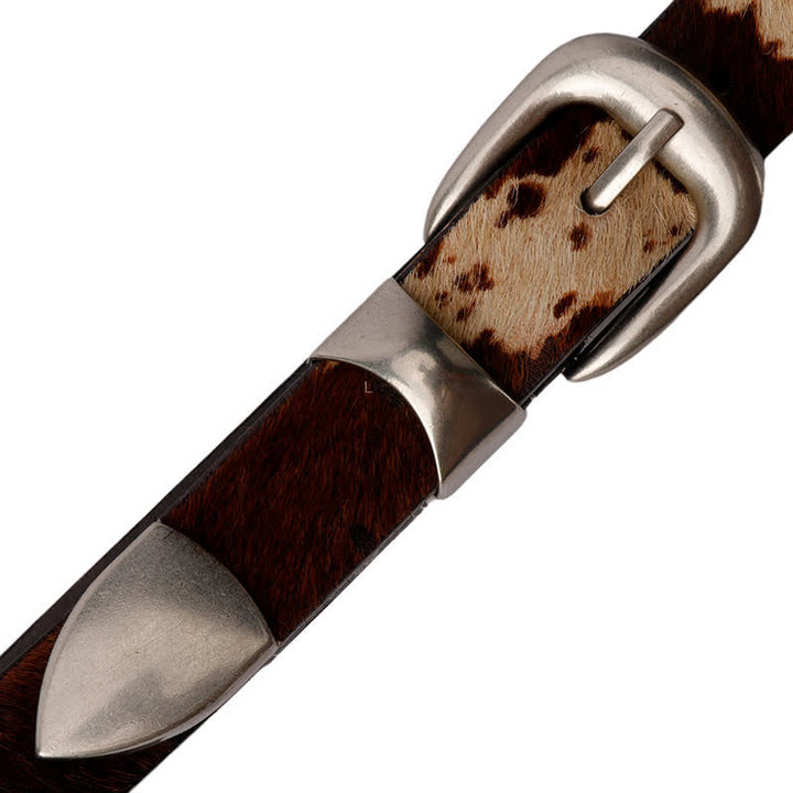 Cinturón de cuero con hebilla plateada clásica y estampado de vaca de piel sintética.