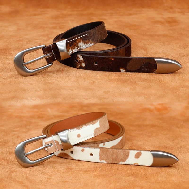 Cinturón de cuero con hebilla plateada clásica y estampado de vaca de piel sintética.