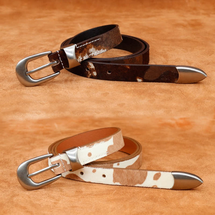 Cinturón de cuero con hebilla plateada clásica y estampado de vaca de piel sintética.