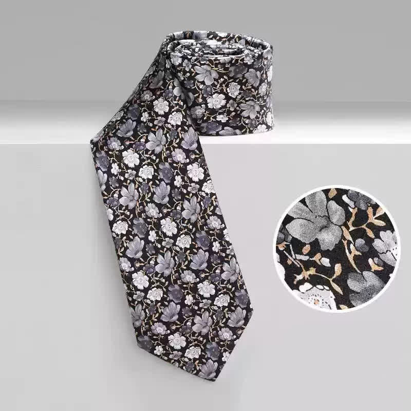 Corbata de seda pura con estampado floral pequeño en gris y negro para hombre