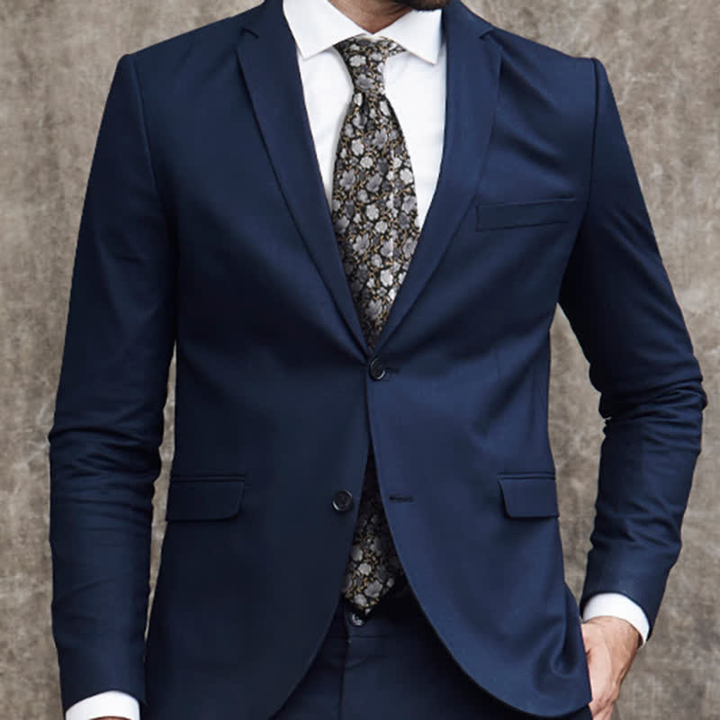 Corbata de seda pura con estampado floral pequeño en gris y negro para hombre