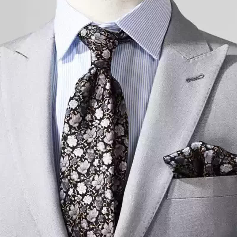 Corbata de seda pura con estampado floral pequeño en gris y negro para hombre