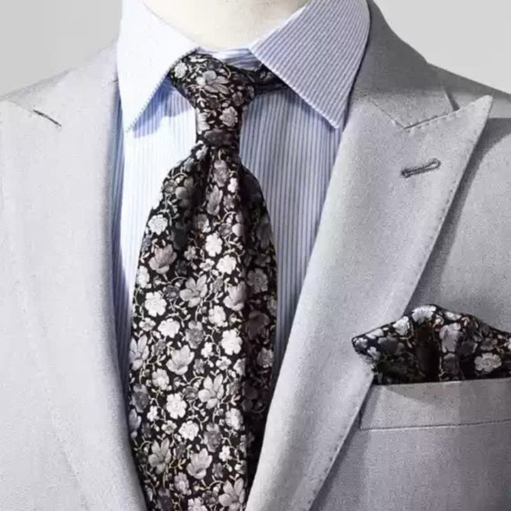 Corbata de seda pura con estampado floral pequeño en gris y negro para hombre