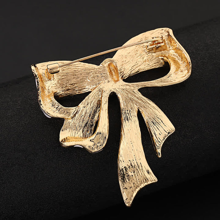 Broche de diamantes de imitación con nudo de lazo y bandera estadounidense