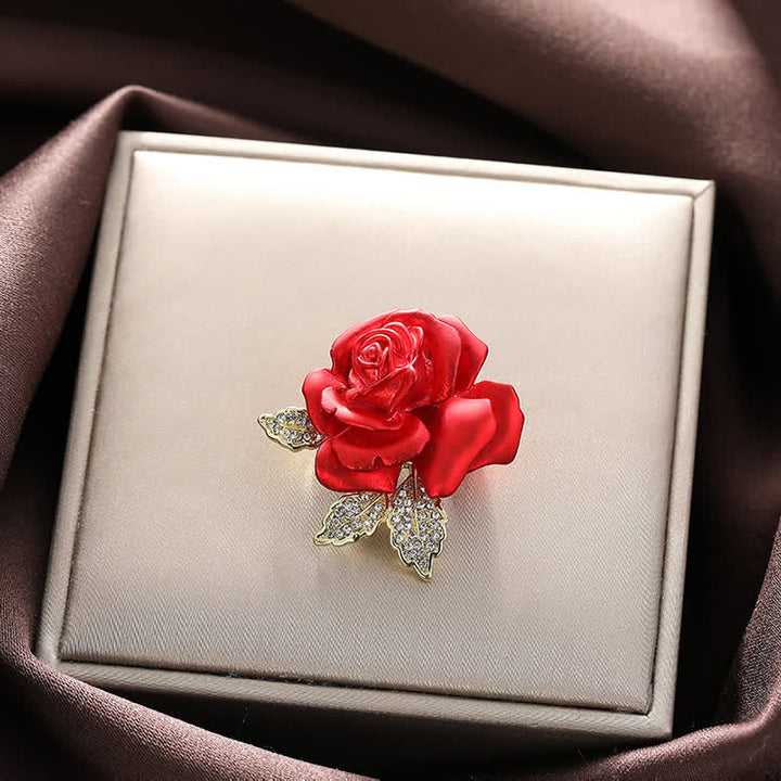 Broche de flor con diamantes de imitación y rosa roja y azul