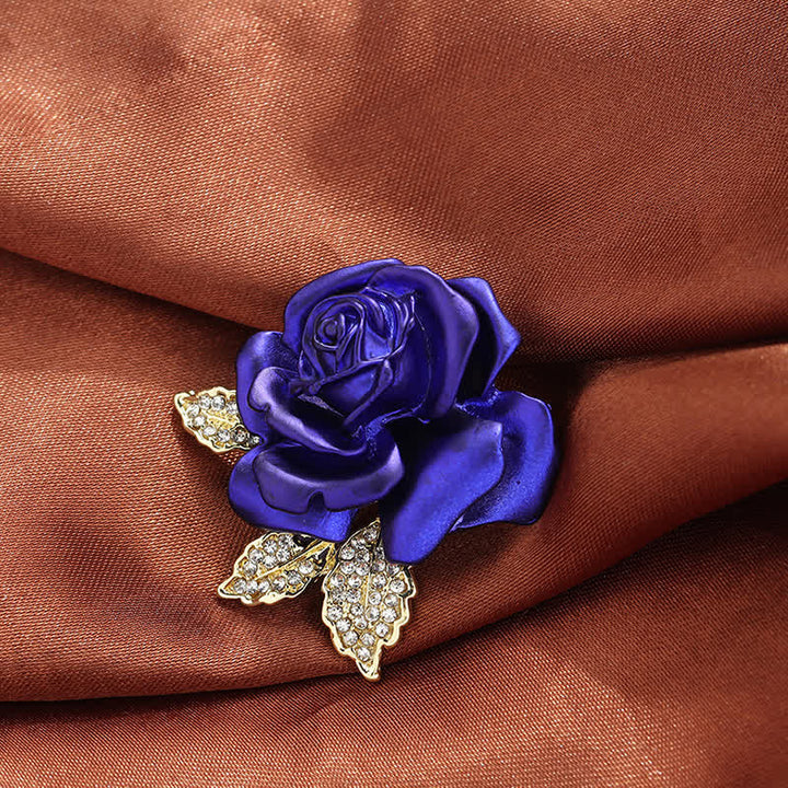 Broche de flor con diamantes de imitación y rosa roja y azul