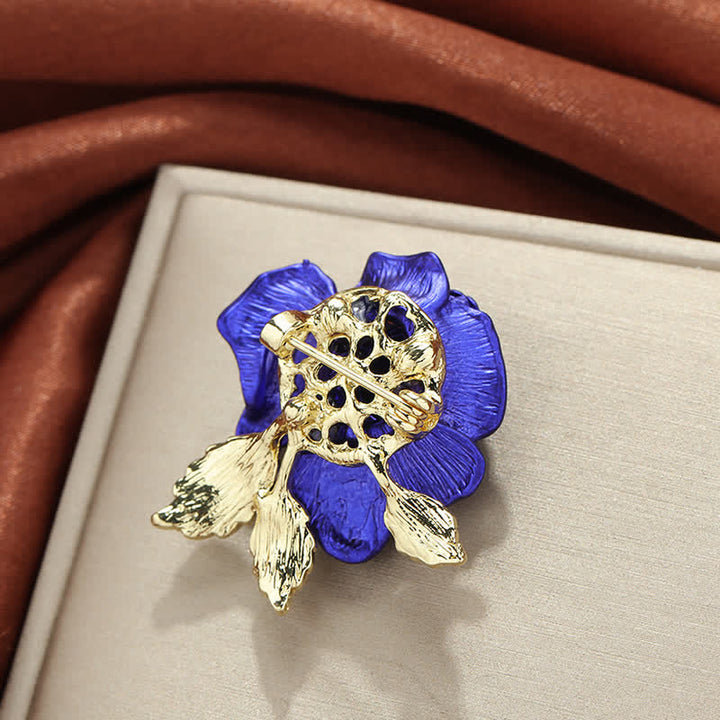 Broche de flor con diamantes de imitación y rosa roja y azul