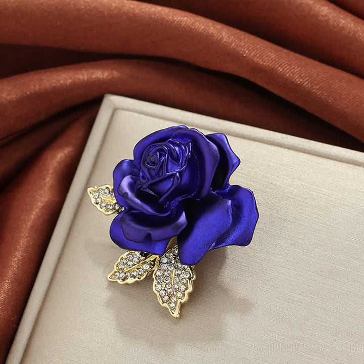 Broche de flor con diamantes de imitación y rosa roja y azul