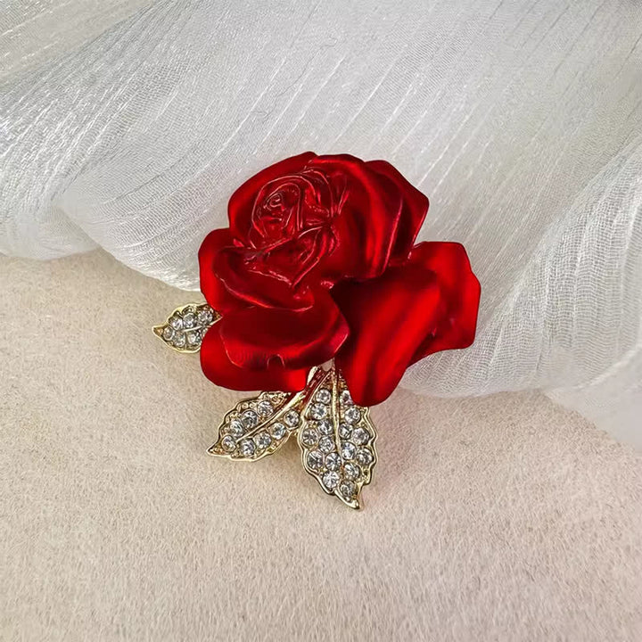 Broche de flor con diamantes de imitación y rosa roja y azul
