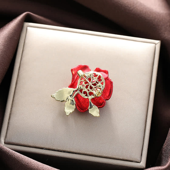 Broche de flor con diamantes de imitación y rosa roja y azul