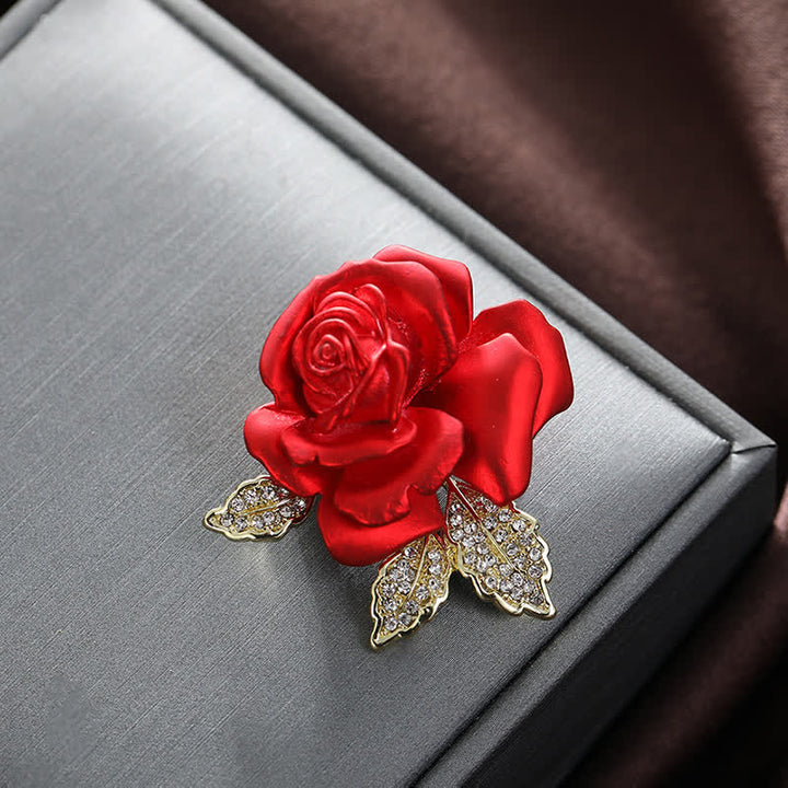 Broche de flor con diamantes de imitación y rosa roja y azul