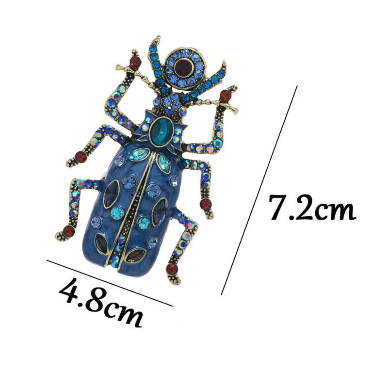 Broche antiguo de cristal coloreado con forma de escarabajo esmaltado de gran tamaño