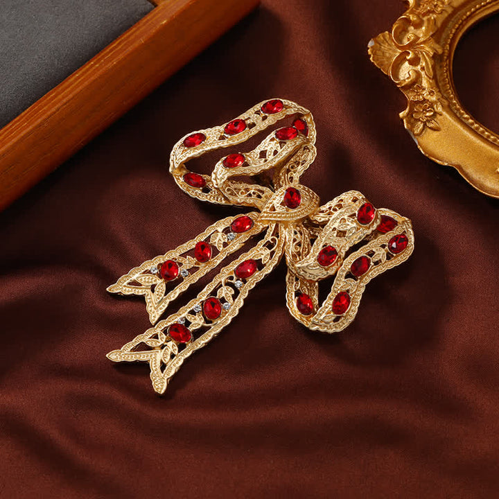 Broche de lazo de cinta metálica ondulada dorada elegante para mujer