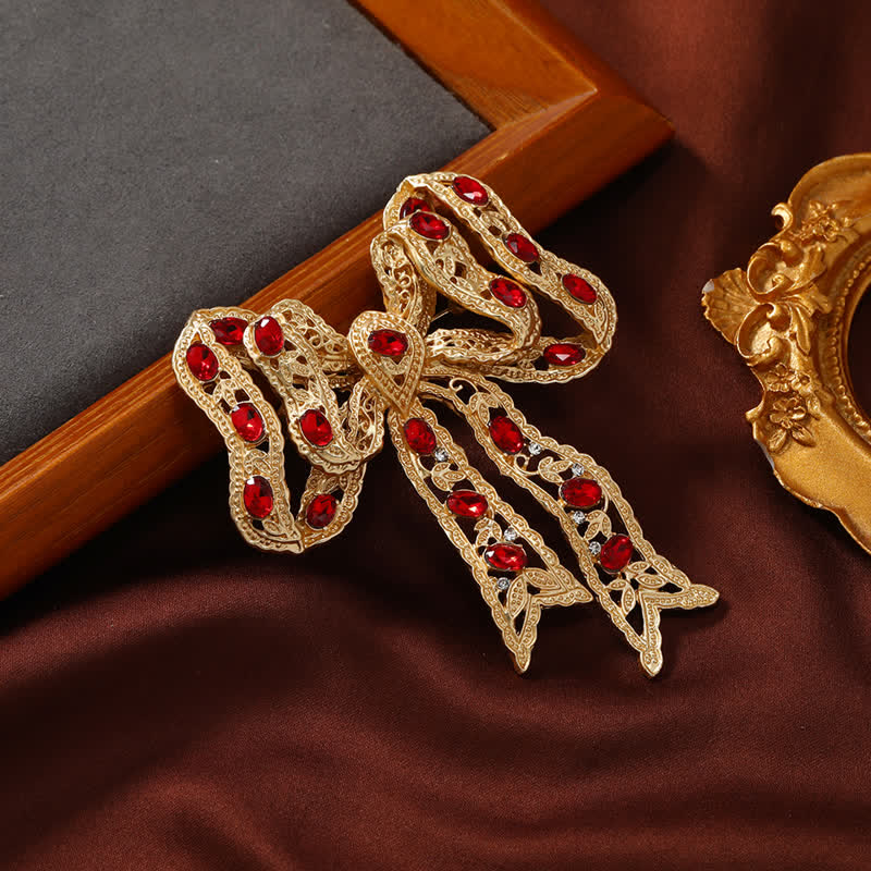 Broche de lazo de cinta metálica ondulada dorada elegante para mujer