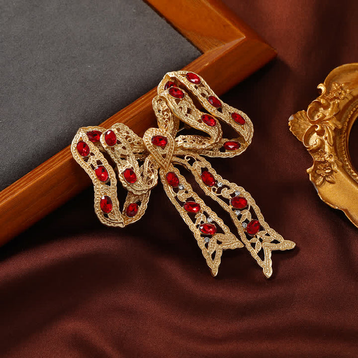 Broche de lazo de cinta metálica ondulada dorada elegante para mujer