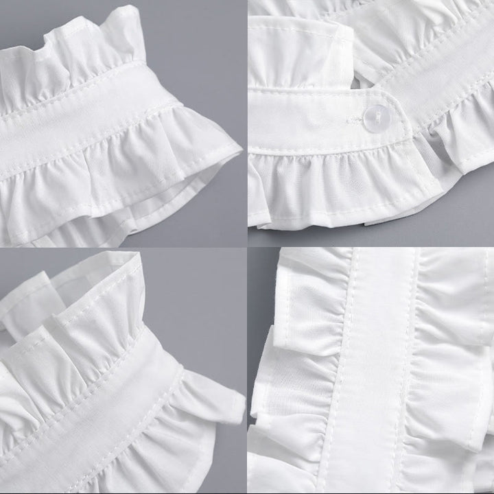 Camisa blanca con cuello plisado y botón desprendible