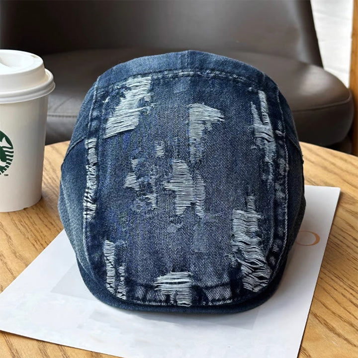 Gorra plana estilo vendedor de periódicos de mezclilla lavada y rasgada