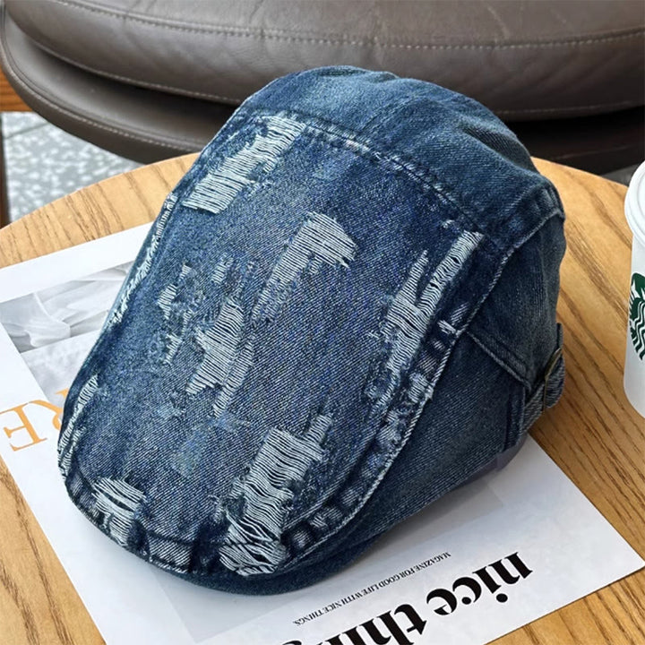 Gorra plana estilo vendedor de periódicos de mezclilla lavada y rasgada