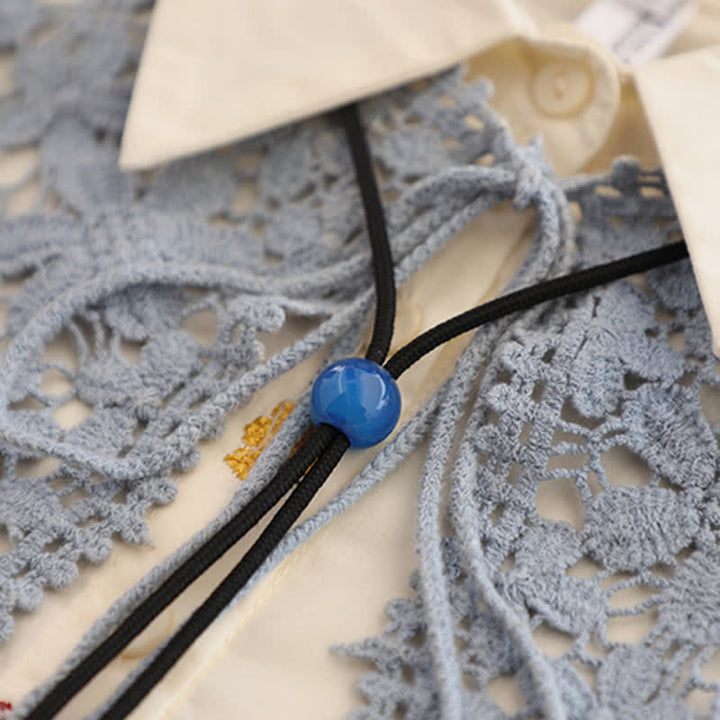 Colgante de ágata azul redondo sencillo hecho a mano con lazo bolo