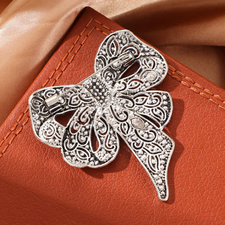 Broche de plata antigua con forma de lazo y diamantes de imitación para mujer