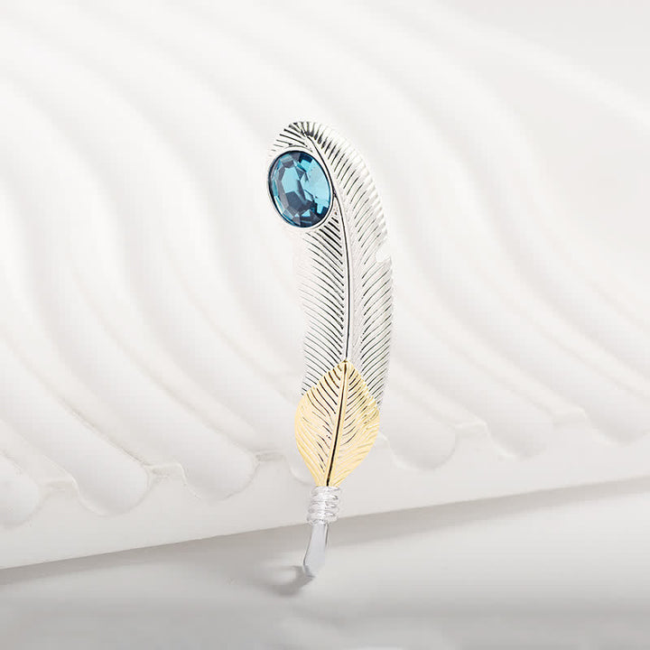 Broche unisex con forma de pluma de cristal azul sintético