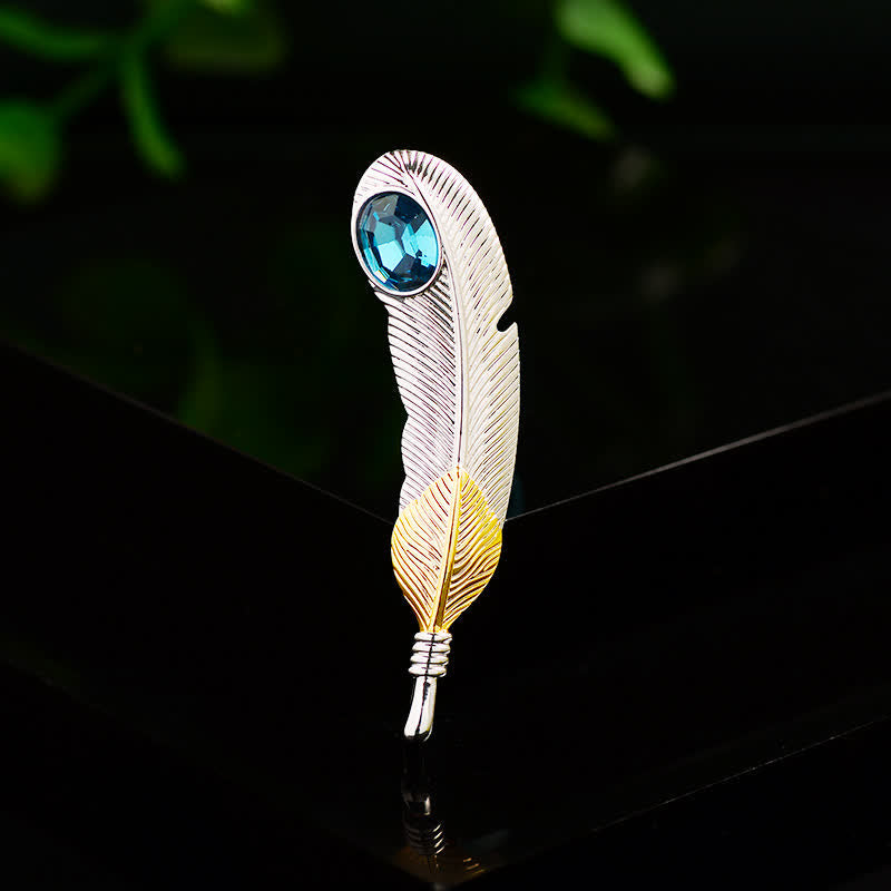 Broche unisex con forma de pluma de cristal azul sintético