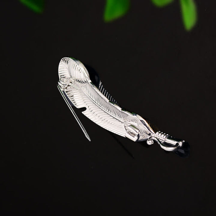 Broche unisex con forma de pluma de cristal azul sintético