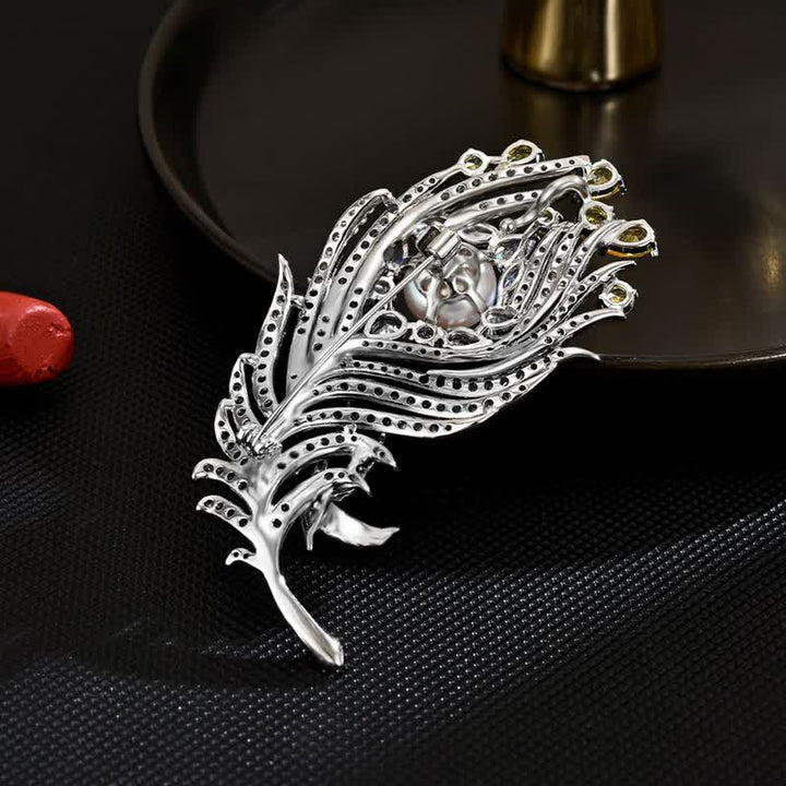Broche unisex con forma de pluma de perla y diamantes de imitación rosas y amarillos