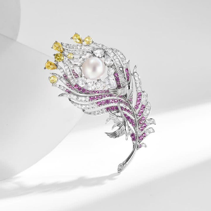 Broche unisex con forma de pluma de perla y diamantes de imitación rosas y amarillos
