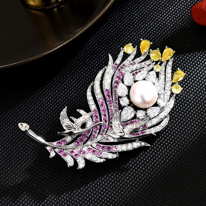 Broche unisex con forma de pluma de perla y diamantes de imitación rosas y amarillos