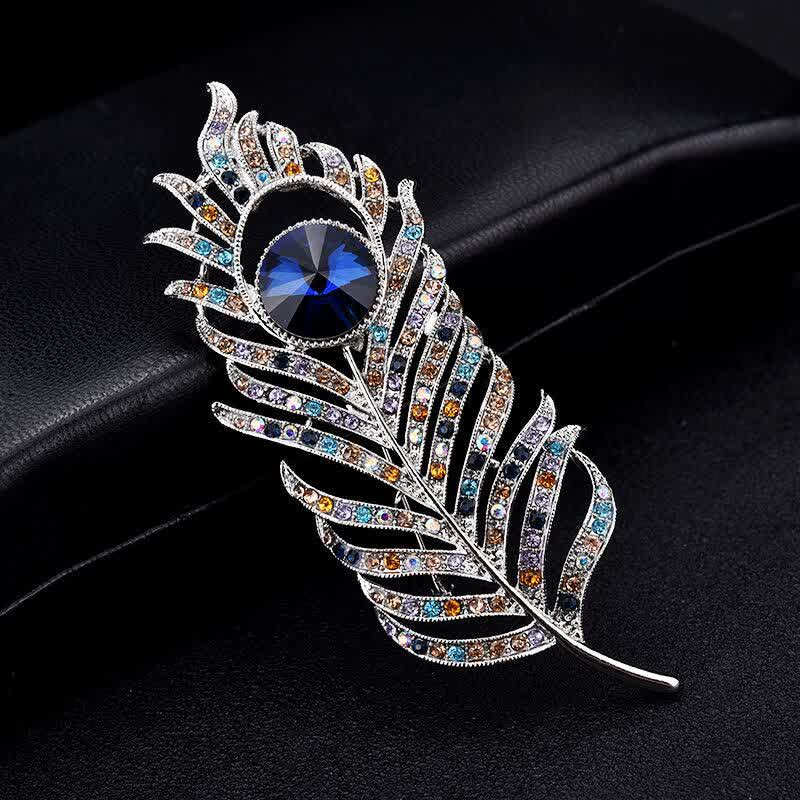 Broche unisex con forma de pluma de fénix y diamantes de imitación de colores.
