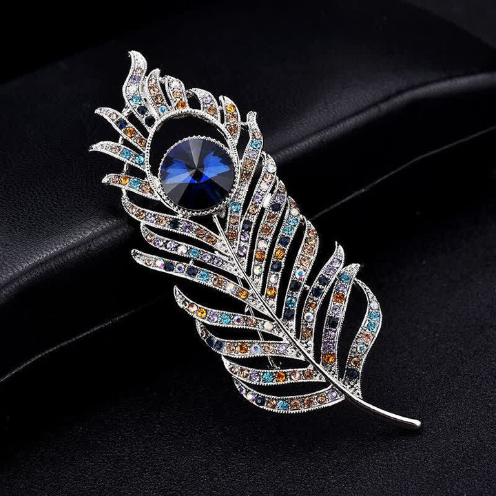 Broche unisex con forma de pluma de fénix y diamantes de imitación de colores.