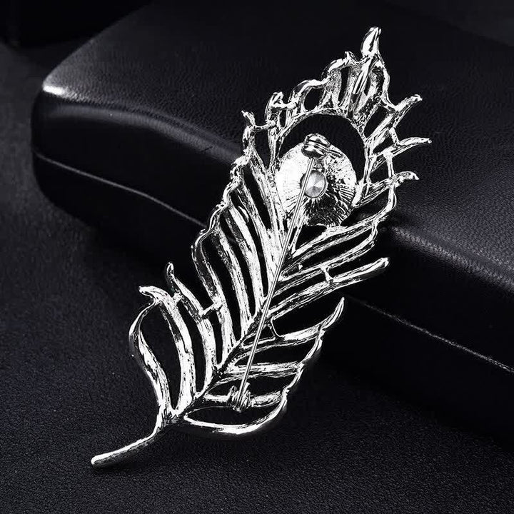 Broche unisex con forma de pluma de fénix y diamantes de imitación de colores.