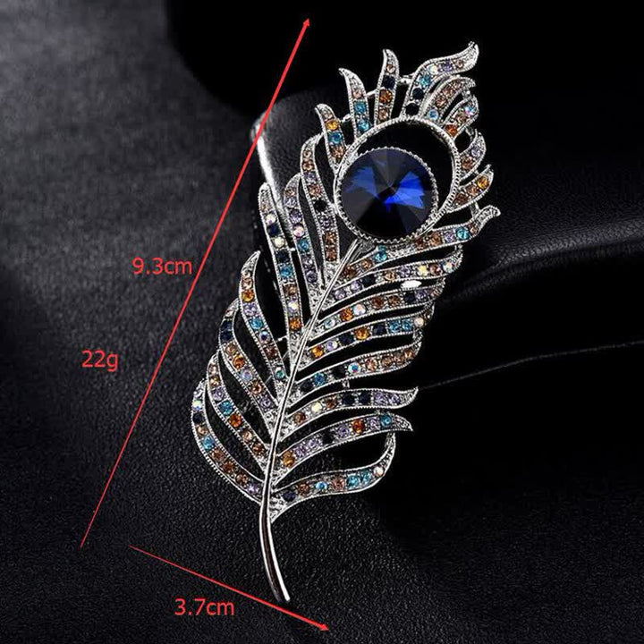 Broche unisex con forma de pluma de fénix y diamantes de imitación de colores.