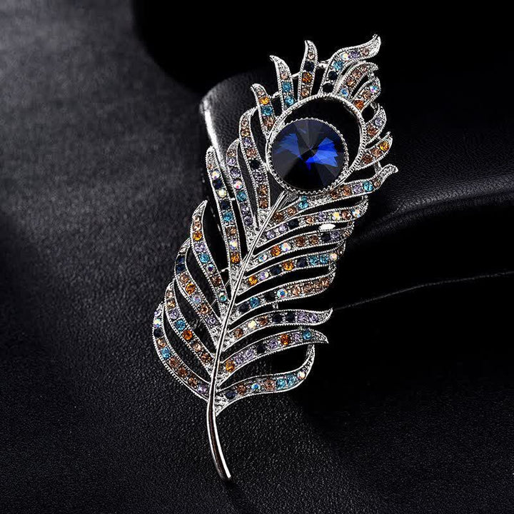 Broche unisex con forma de pluma de fénix y diamantes de imitación de colores.