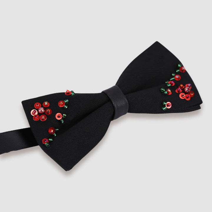 Pajarita negra con bordado de cuentas y forma de flor