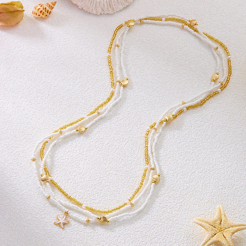 Cadena de cintura bohemia de playa para mujer con múltiples capas de cuentas de concha y estrella de mar