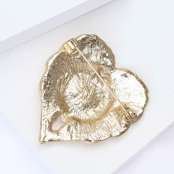 Broche de lujo con forma de corazón dorado y flor de amapola esmaltada