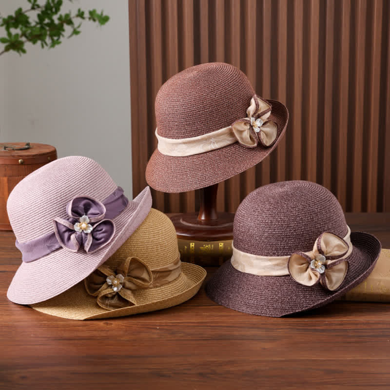 Sombrero de paja para mujer con cinta de flores y decoración de margaritas.