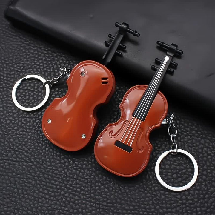 Lindo llavero con encendedor de butano y diseño de violín.