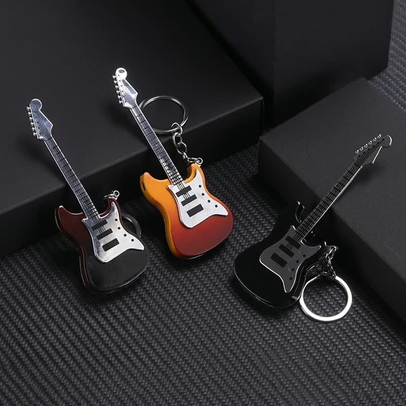 Llavero inflable con forma de guitarra y encendedor de butano.