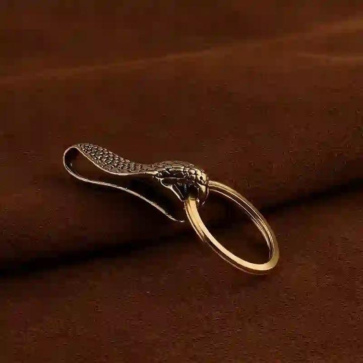 Llavero con clip para cinturón de estatua de cabeza de serpiente de latón macizo