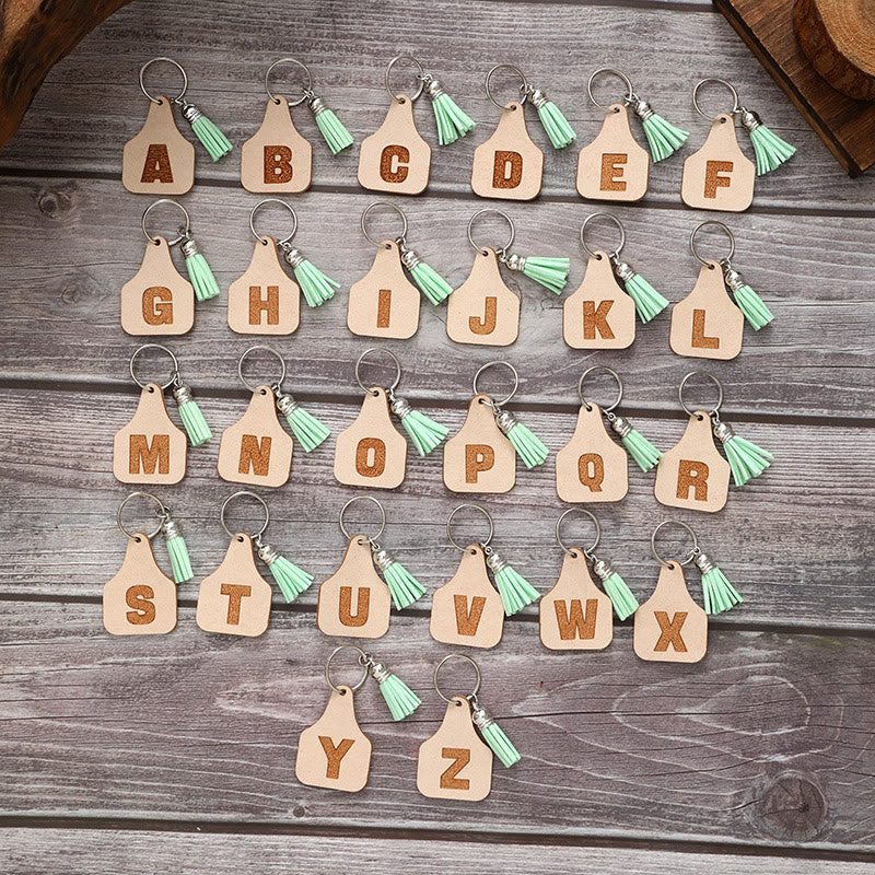 Llavero con borla verde y letras de estilo minimalista de granja - image 1