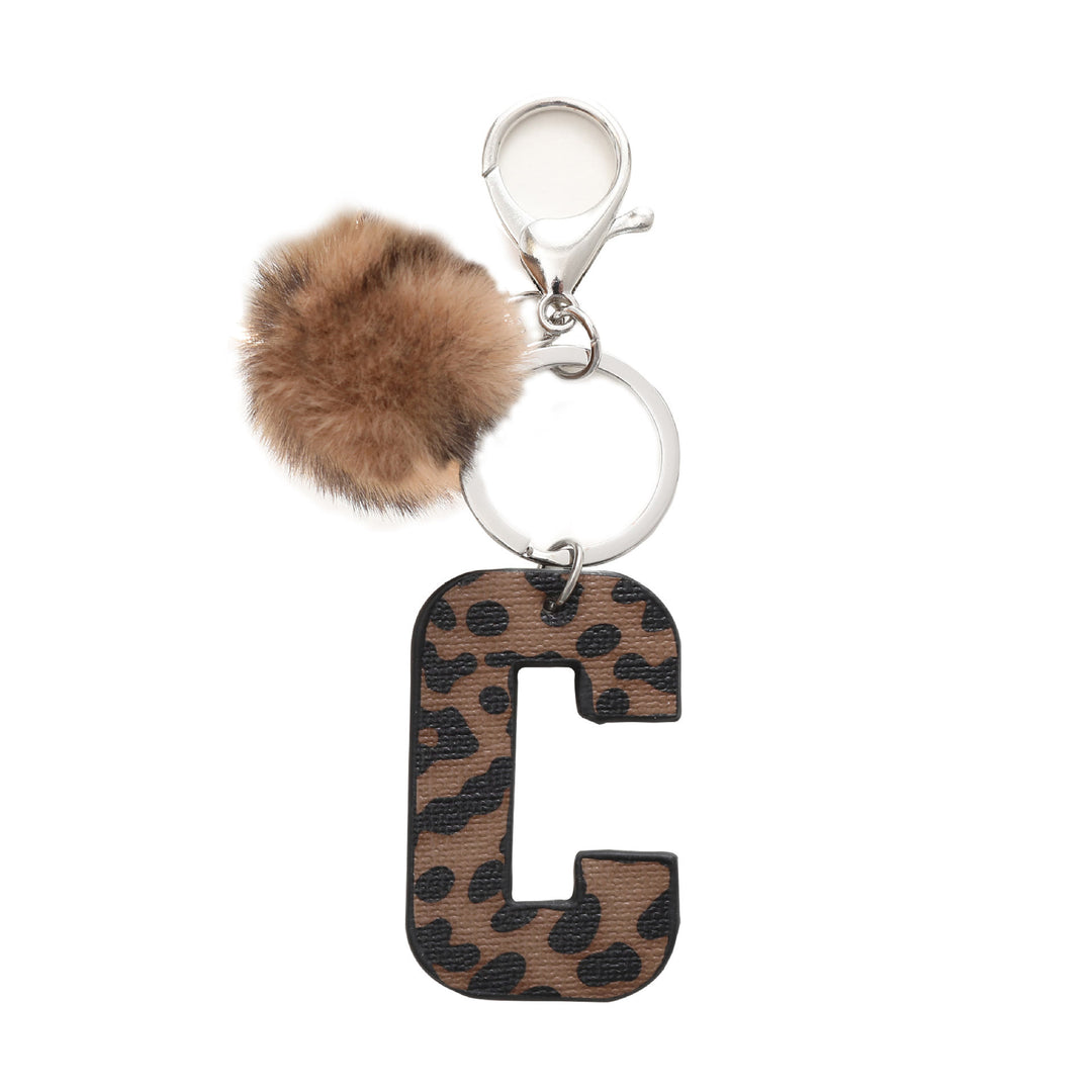 Llavero de cuero con letras y estampado de leopardo estilo occidental con bola de peluche - C - image 5