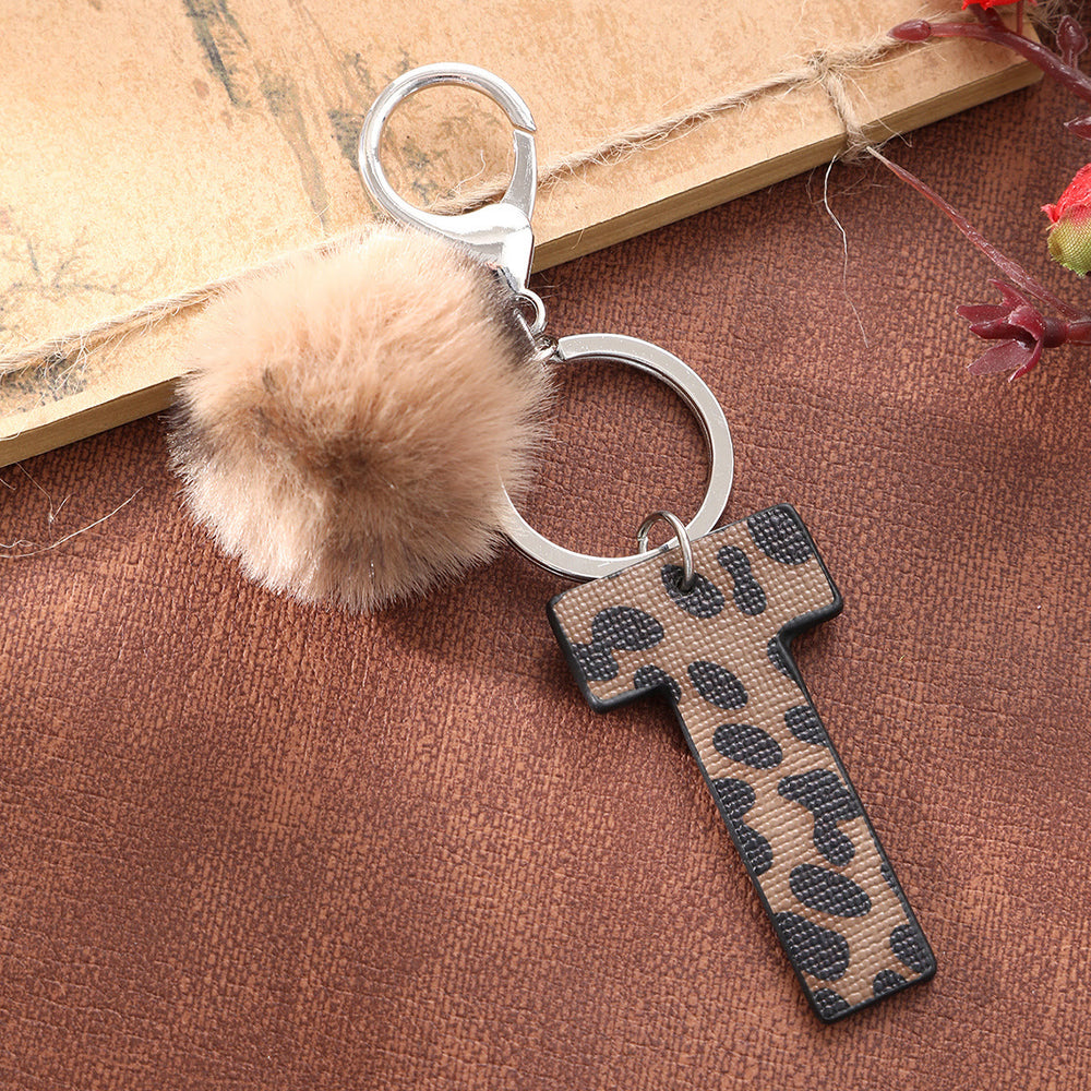 Llavero de cuero con letras y estampado de leopardo estilo occidental con bola de peluche - image 2