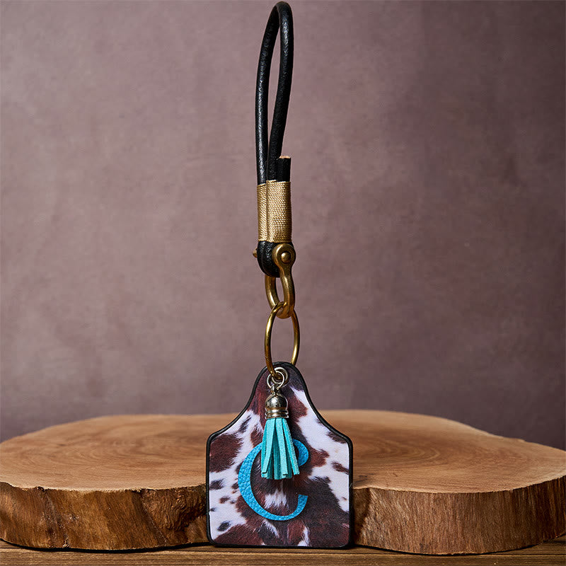 Llavero con hebilla de herradura y colgante con estampado de vaca occidental - image 3