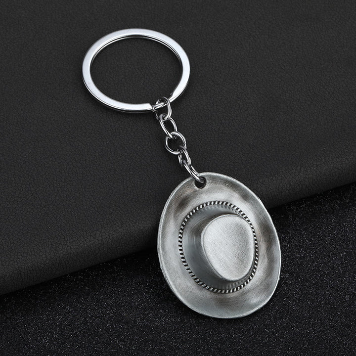 Llavero con colgante de sombrero de vaquero y letra con estampado de leopardo - image 5