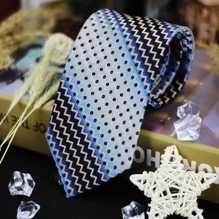 Corbata de hombre con rayas en zigzag y lunares en azul degradado y negro